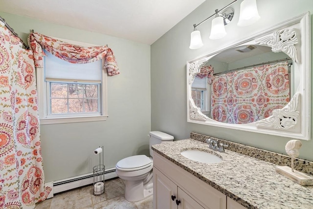 bathroom with baseboard heating, vanity, and toilet