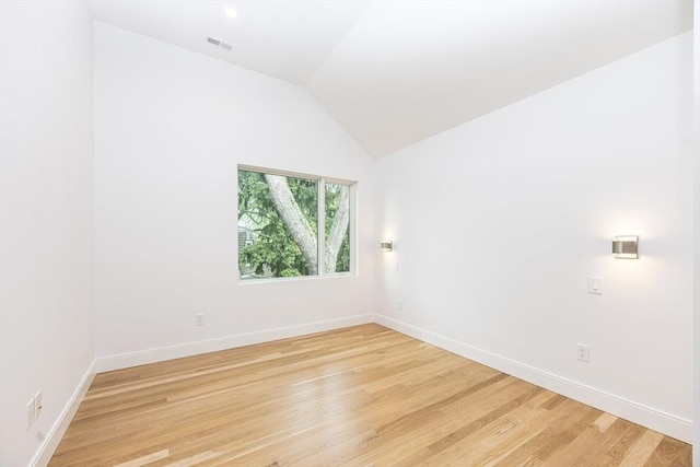 93 Griswold St Unit 93, Cambridge, MA 02138 - unfurnished room featuring light wood-style flooring, baseboards, and lofted ceiling