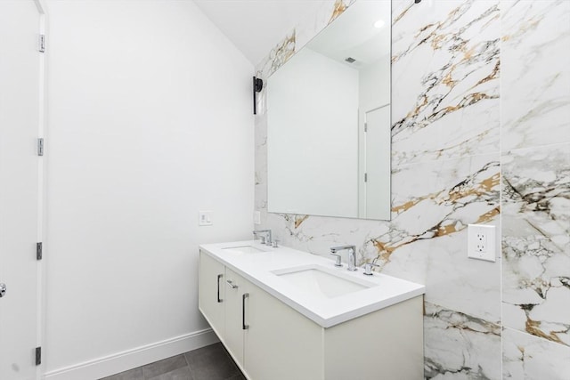 93 Griswold St Unit 93, Cambridge, MA 02138 - bathroom featuring double vanity and lofted ceiling