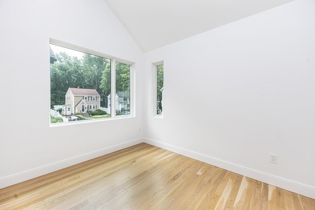 93 Griswold St Unit 93, Cambridge, MA 02138 - spare room with baseboards, wood finished floors, and vaulted ceiling