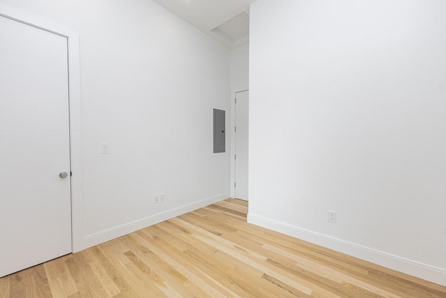 93 Griswold St Unit 93, Cambridge, MA 02138 - empty room featuring electric panel, light wood-style floors, baseboards, and attic access