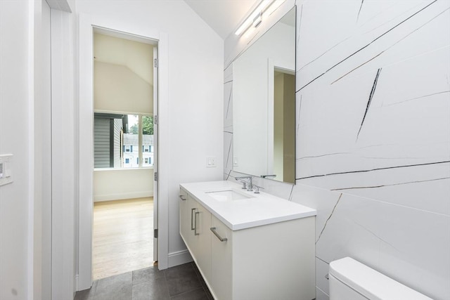 93 Griswold St Unit 93, Cambridge, MA 02138 - half bath with lofted ceiling, vanity, and toilet