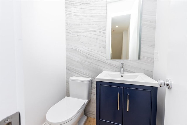 93 Griswold St Unit 93, Cambridge, MA 02138 - bathroom featuring toilet, tile walls, and vanity