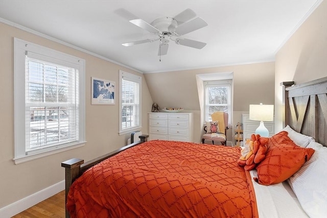 bedroom with light wood-type flooring, baseboards, ornamental molding, and ceiling fan