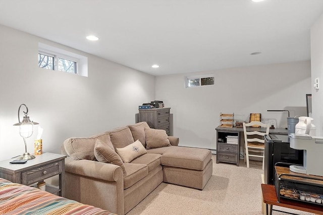 living area with recessed lighting and light carpet