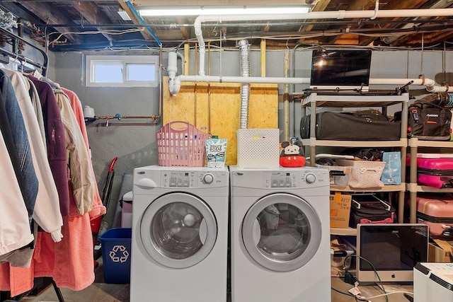 clothes washing area with laundry area and washer and clothes dryer