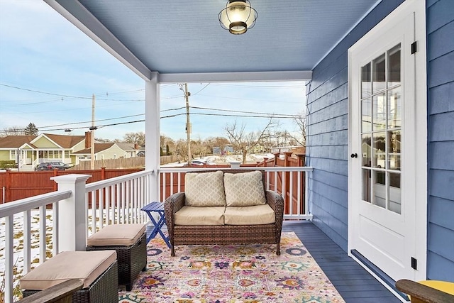 wooden deck with a residential view and fence