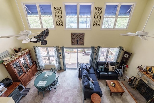 64 Porcupine Point Rd, Tolland, MA 01034 - living area with a ceiling fan, a towering ceiling, and healthy amount of natural light