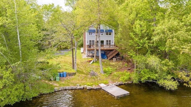 64 Porcupine Point Rd, Tolland, MA 01034 - rear view of property with stairs, a deck with water view, and a forest view