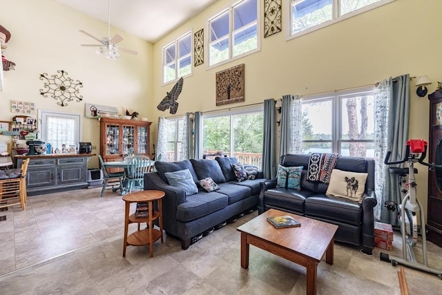 64 Porcupine Point Rd, Tolland, MA 01034 - living room featuring a high ceiling, healthy amount of natural light, and a ceiling fan
