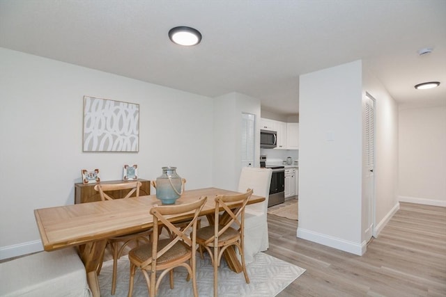 45 Macy St Unit 200A, Amesbury, MA 01913 - dining space featuring light wood-style flooring and baseboards