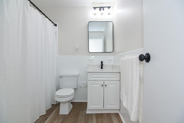 45 Macy St Unit 200A, Amesbury, MA 01913 - full bathroom featuring wood finished floors, vanity, a wainscoted wall, and tile walls