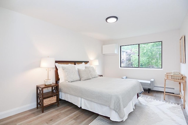 45 Macy St Unit 200A, Amesbury, MA 01913 - bedroom with light wood finished floors and baseboard heating