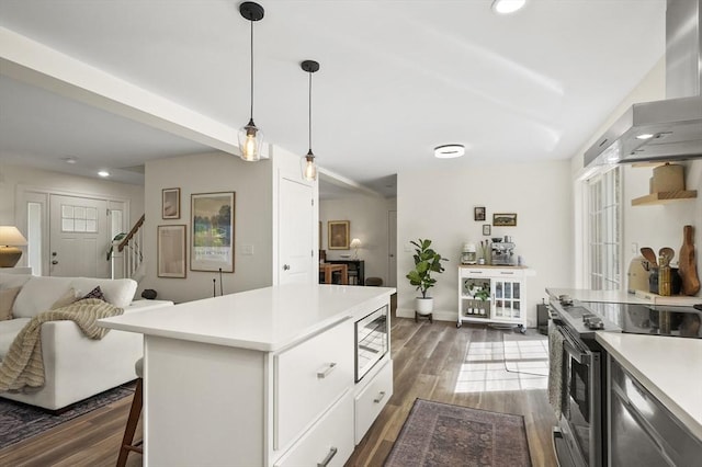 1076 King Phillip Trl, Templeton, MA 01468 - kitchen with stainless steel appliances, wall chimney exhaust hood, dark wood-style flooring, light countertops, and recessed lighting