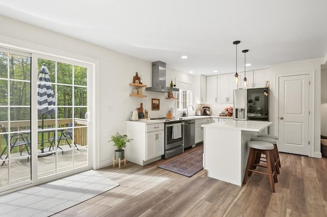 1076 King Phillip Trl, Templeton, MA 01468 - kitchen with wall chimney exhaust hood, appliances with stainless steel finishes, a sink, white cabinetry, and recessed lighting