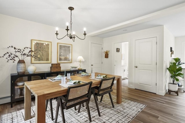 1076 King Phillip Trl, Templeton, MA 01468 - dining area with a chandelier, wood finished floors, baseboards, and a baseboard radiator