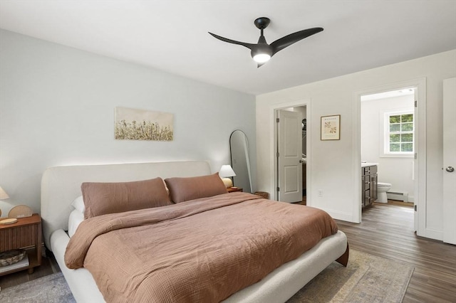 1076 King Phillip Trl, Templeton, MA 01468 - bedroom featuring baseboard heating, wood finished floors, ensuite bathroom, baseboards, and ceiling fan
