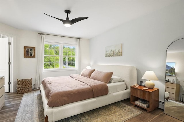 1076 King Phillip Trl, Templeton, MA 01468 - bedroom featuring dark wood finished floors, baseboard heating, and a ceiling fan