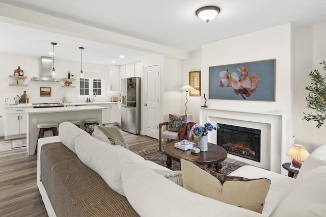 1076 King Phillip Trl, Templeton, MA 01468 - living room with wood finished floors, a glass covered fireplace, and recessed lighting