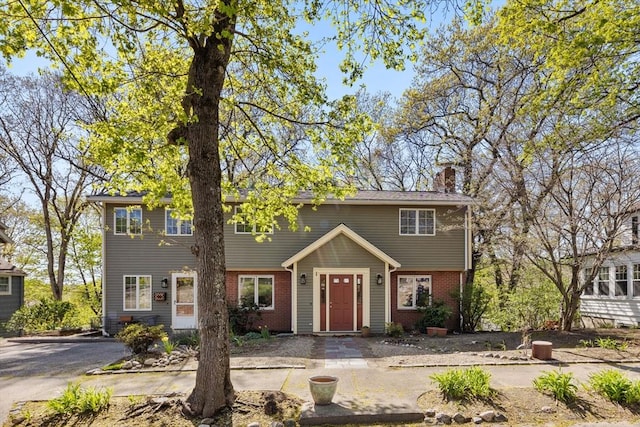 43 Grove Hill Park, Newton, MA 02460 - view of front of house with a chimney and brick siding
