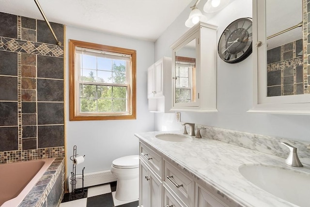 728 River St, Winchendon, MA 01475 - bathroom with double vanity, toilet, a baseboard heating unit, and baseboards
