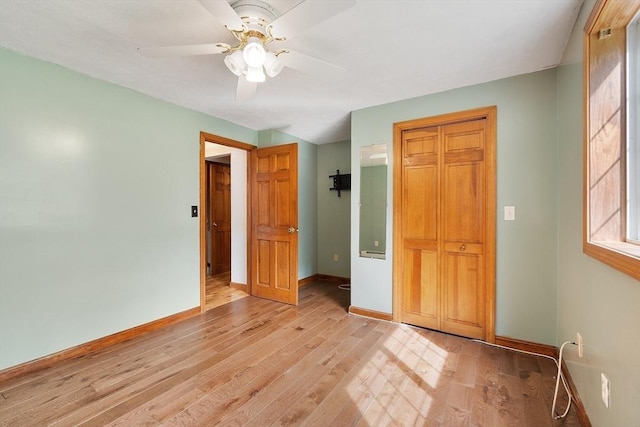728 River St, Winchendon, MA 01475 - unfurnished bedroom with baseboards, light wood-style flooring, and a ceiling fan