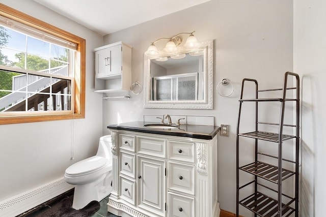 728 River St, Winchendon, MA 01475 - full bath featuring vanity, baseboard heating, toilet, a shower with door, and baseboards