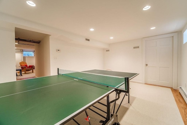 rec room with light wood-type flooring, recessed lighting, and visible vents