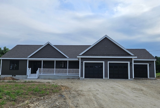 view of front of home featuring a garage and covered porch