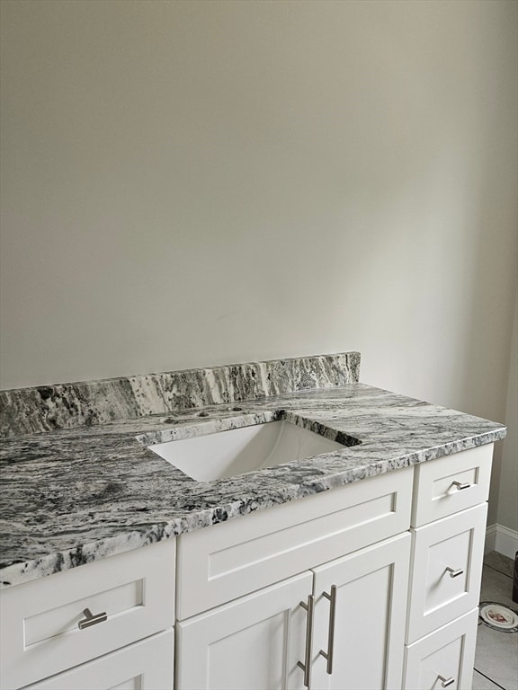 bathroom with vanity and tile patterned flooring