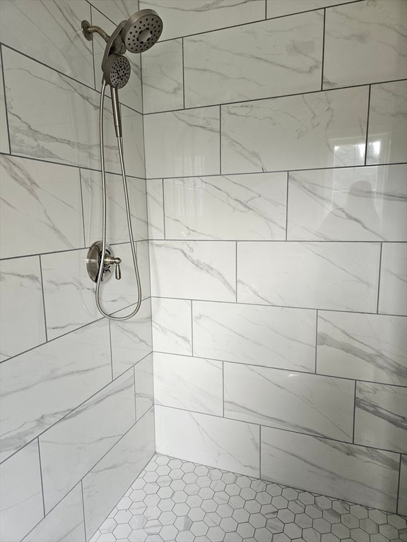 interior space with tiled shower