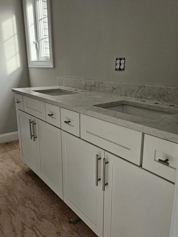 bathroom featuring vanity and hardwood / wood-style floors