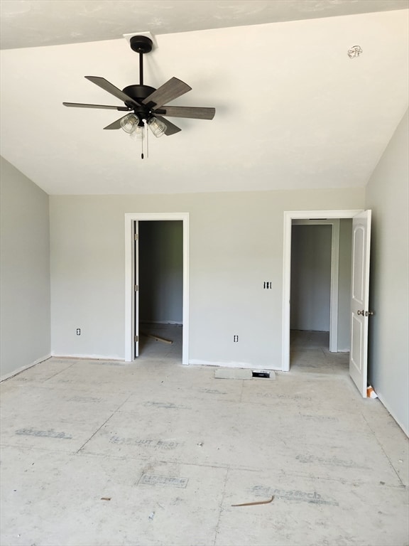 unfurnished room featuring ceiling fan and lofted ceiling