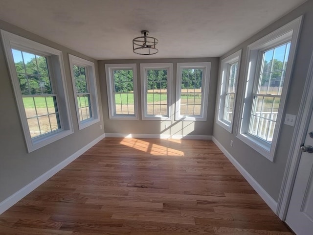 unfurnished sunroom with a healthy amount of sunlight