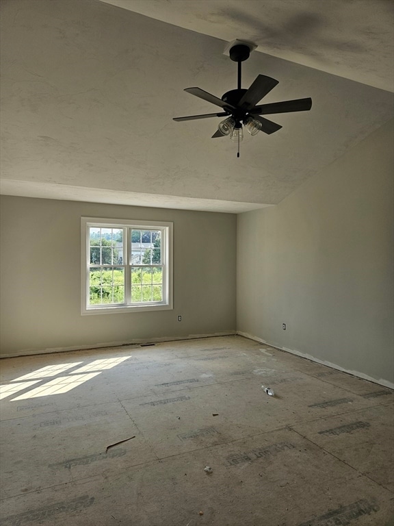 unfurnished room with high vaulted ceiling and ceiling fan