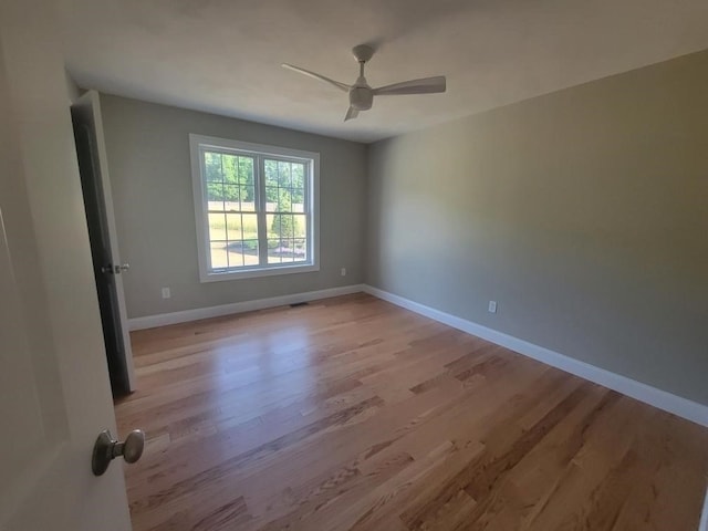 unfurnished room with ceiling fan and light hardwood / wood-style floors