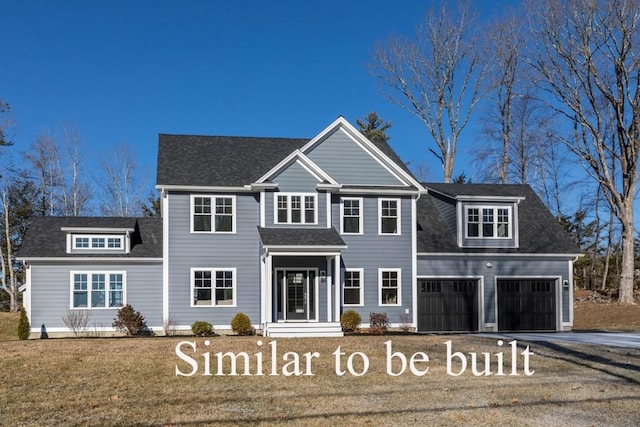 view of front of house featuring a front yard, a garage, driveway, and roof with shingles