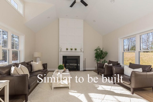 living area with a wealth of natural light, a fireplace, high vaulted ceiling, and ceiling fan