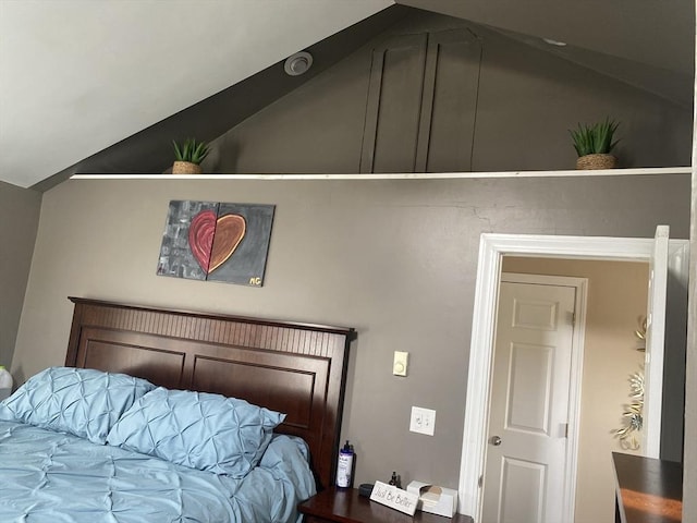 bedroom featuring vaulted ceiling