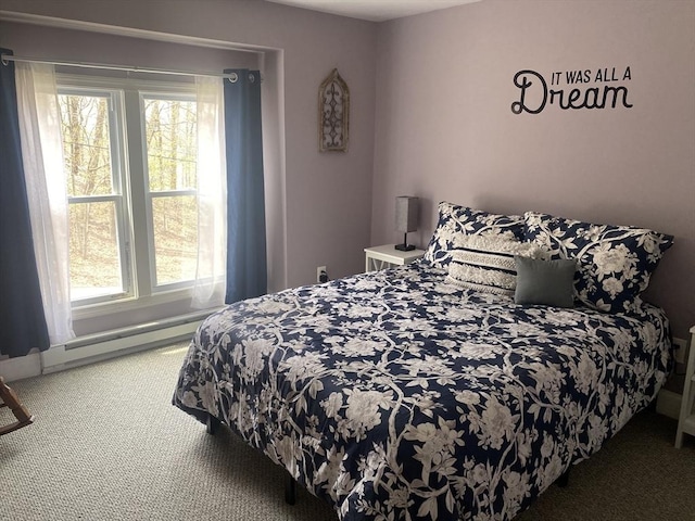 carpeted bedroom with multiple windows and a baseboard heating unit