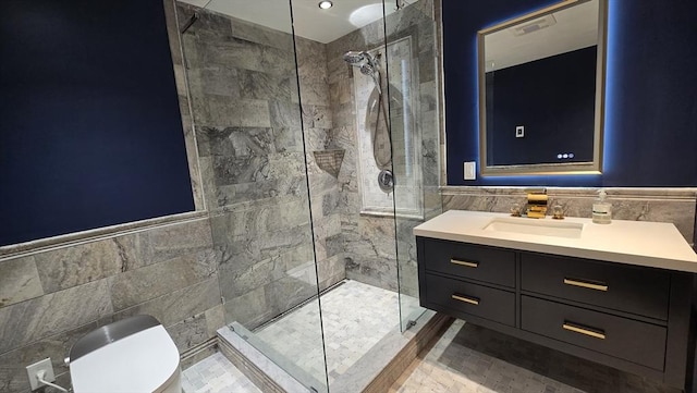 9 Venner Rd, Arlington, MA 02476 - full bath with tile walls, vanity, a tile shower, toilet, and wainscoting