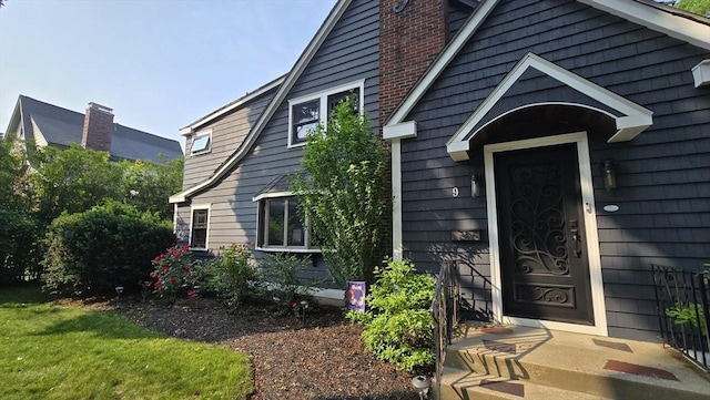 9 Venner Rd, Arlington, MA 02476 - view of exterior entry with a chimney