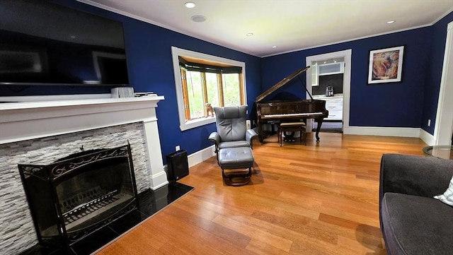9 Venner Rd, Arlington, MA 02476 - sitting room with baseboards, ornamental molding, wood finished floors, and a fireplace