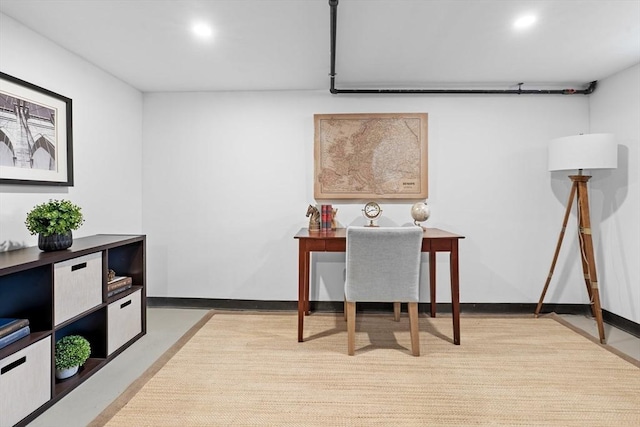 office area with recessed lighting, baseboards, and finished concrete flooring