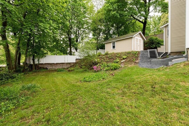 view of yard with a storage unit and an outdoor structure