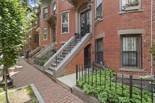 property entrance with brick siding