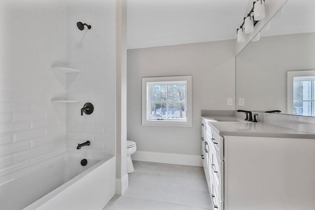 bathroom featuring a wealth of natural light, toilet, vanity, and baseboards