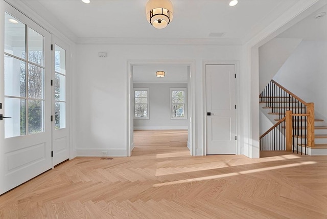 foyer featuring stairway, recessed lighting, baseboards, and ornamental molding