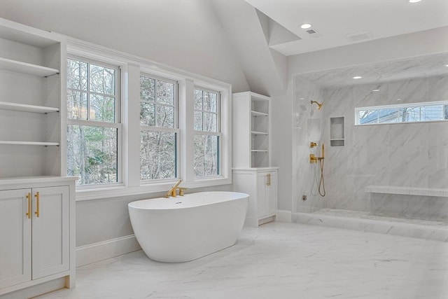 bathroom with baseboards, marble finish floor, a marble finish shower, and a freestanding bath