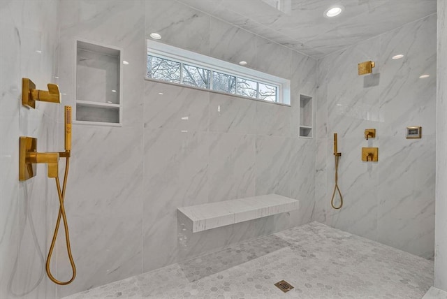 full bathroom with a marble finish shower and recessed lighting